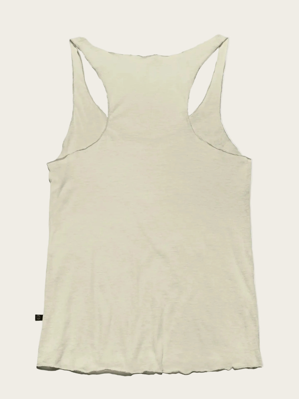 The back view of a light cream or off-white racerback tank top, displayed flat against a solid light gray background.