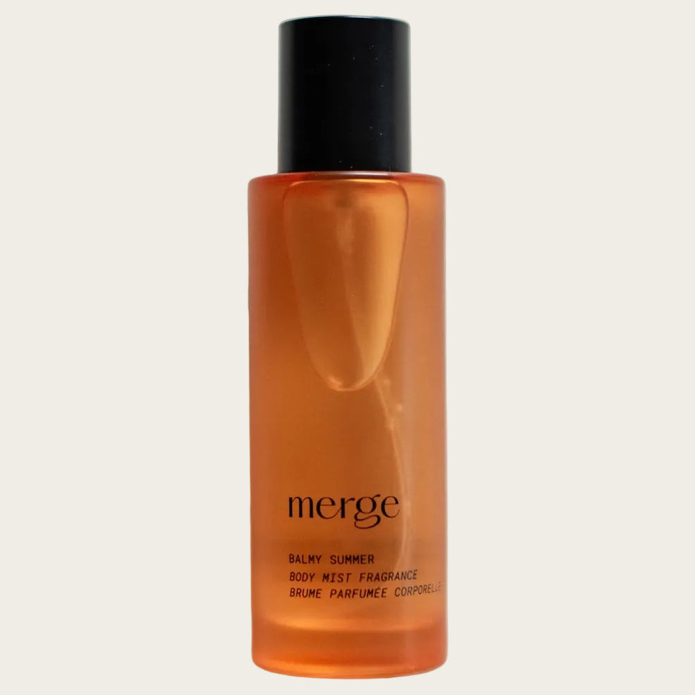 Orange bottle with black cap labeled 'merge' on a light gray background
