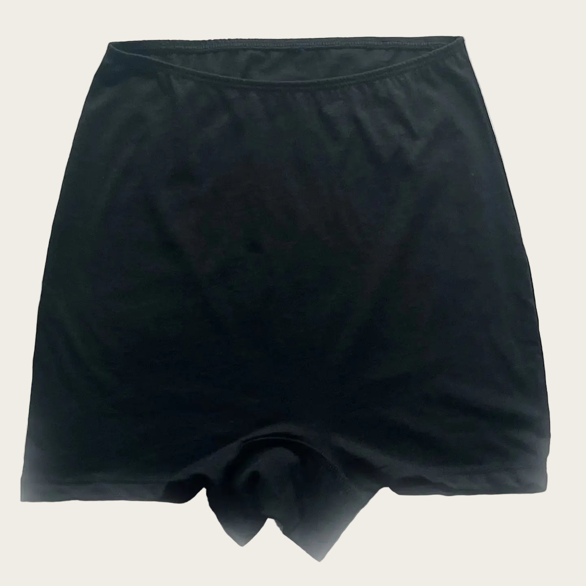 Black high-waisted compression shorts with a built-in pouch at the front, shown flat on a light gray background.