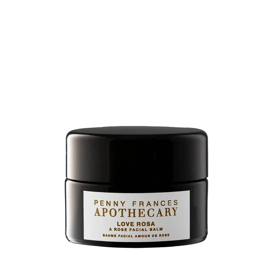 Penny Frances Apothecary Love Rosa Rose Facial Balm in a black jar with a white label, centered on a solid white background.