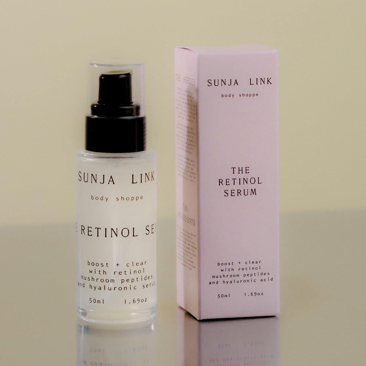 Sunja Link Retinol Serum bottle and packaging on a reflective surface with a neutral background
