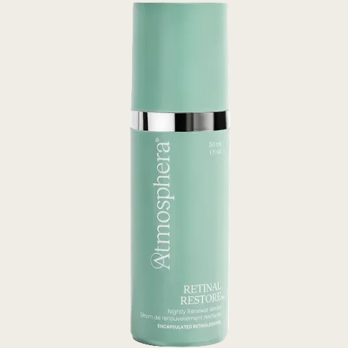 Atmosphere Retinal Restore serum in a mint green cylindrical bottle with a silver metallic band and white text, set against a clean white background.