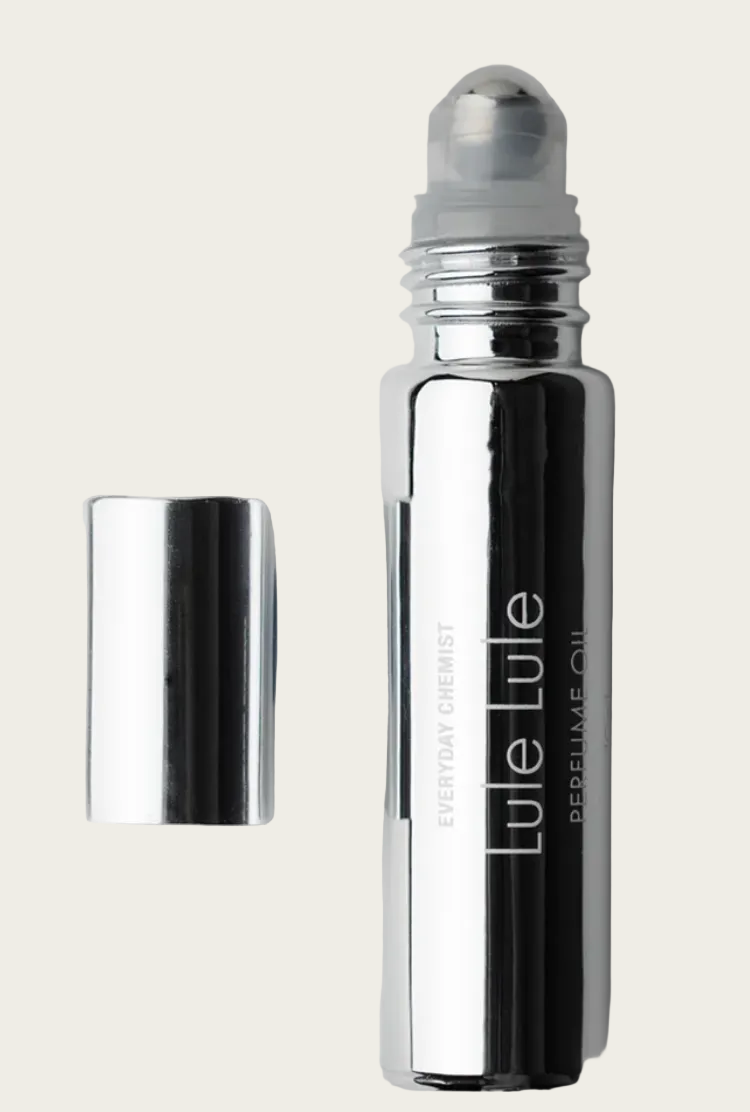 Silver rollerball bottle with cap on a light gray background
