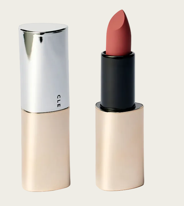 Lipstick with beige casing and silver top on a light gray background