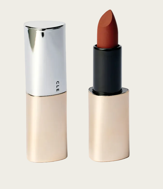 Lipstick with beige casing and brown shade on a light gray background