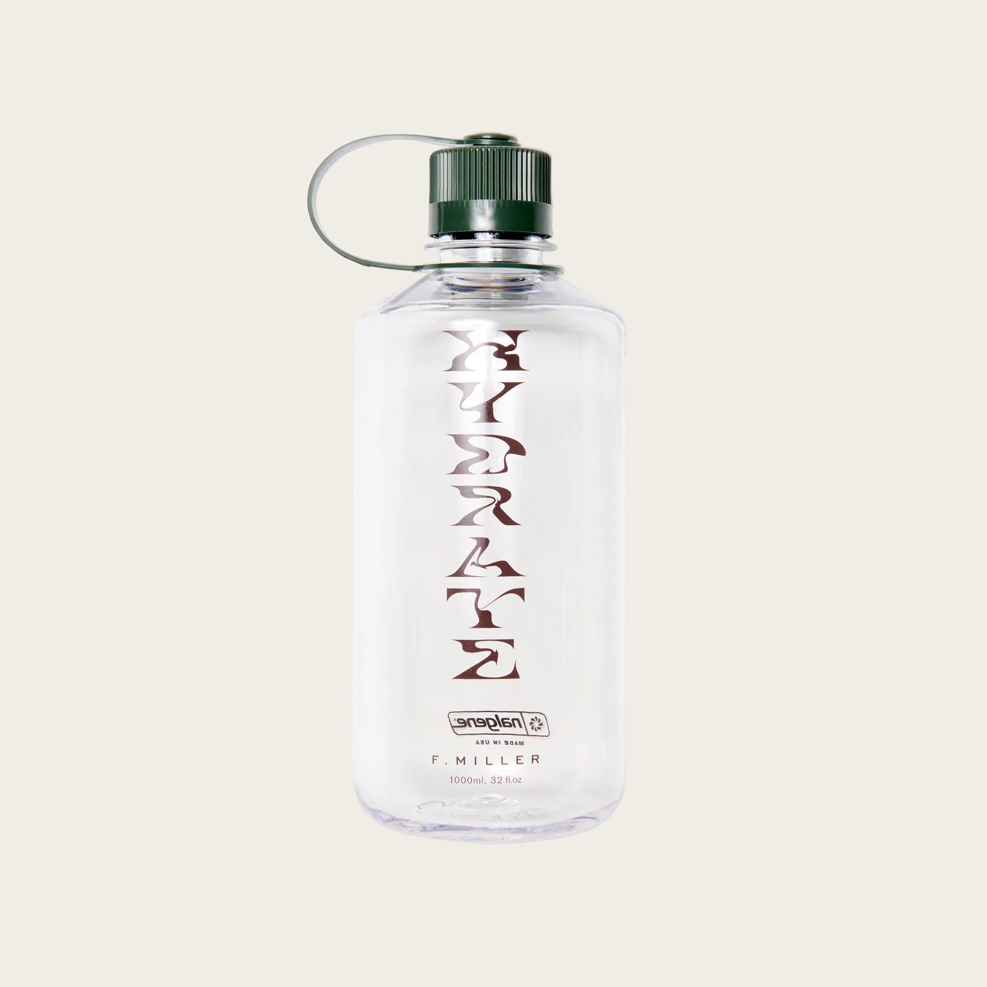 A clear plastic water bottle with a dark green cap and a silver carrying loop, featuring the word 'HYDRATE' printed vertically in a dark reddish-brown font. The brand 'sanspenal' and 'F.