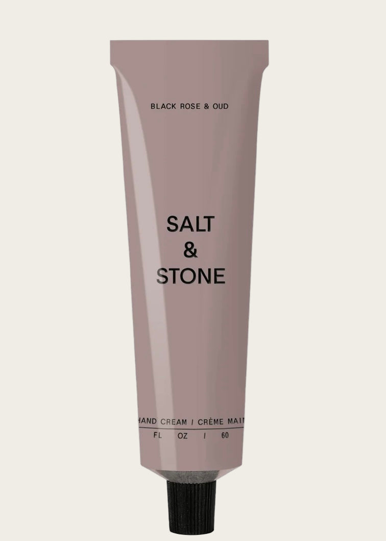 Tube of Salt & Stone hand cream on a black background