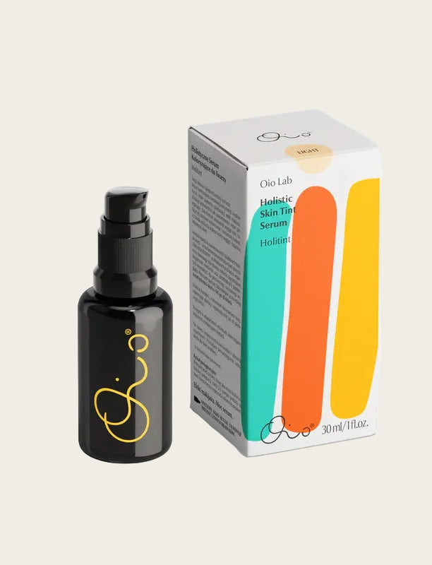 Black serum bottle with a colorful box on a white background