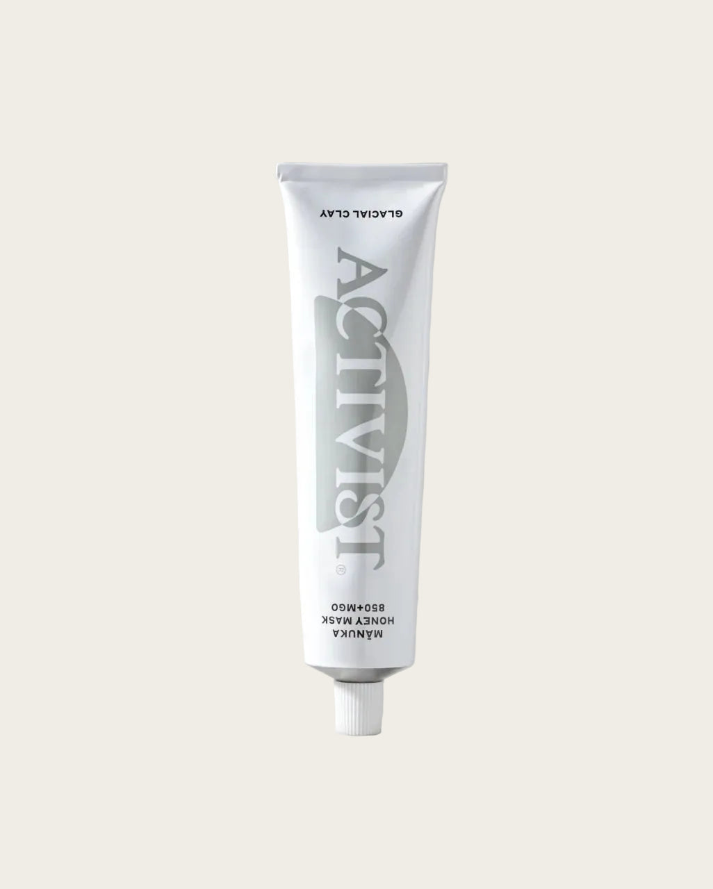 A white squeeze tube of Activist Honey Mask Hyalupe cosmetic product standing upright on a neutral beige background.