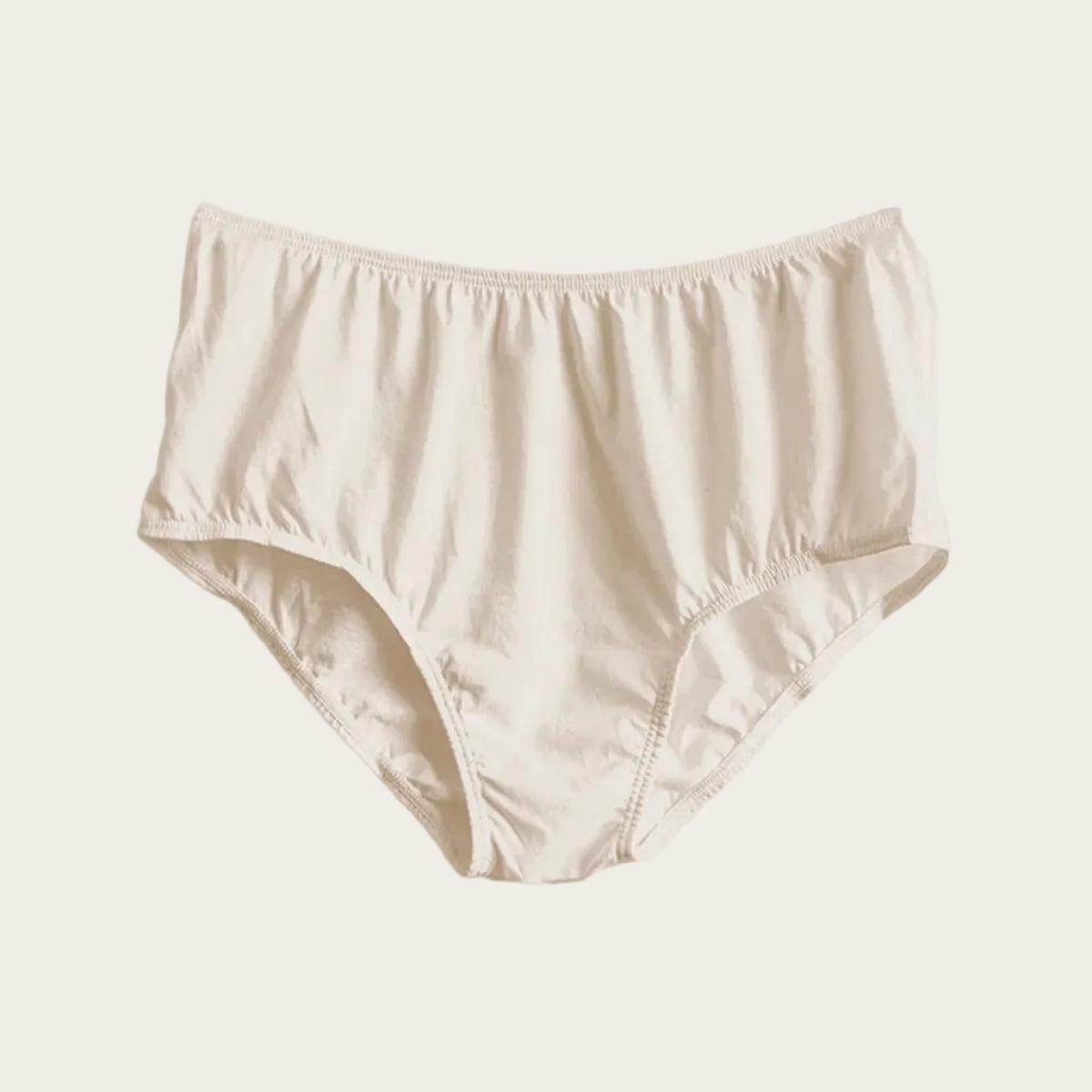 Beige women's underwear on a light gray background