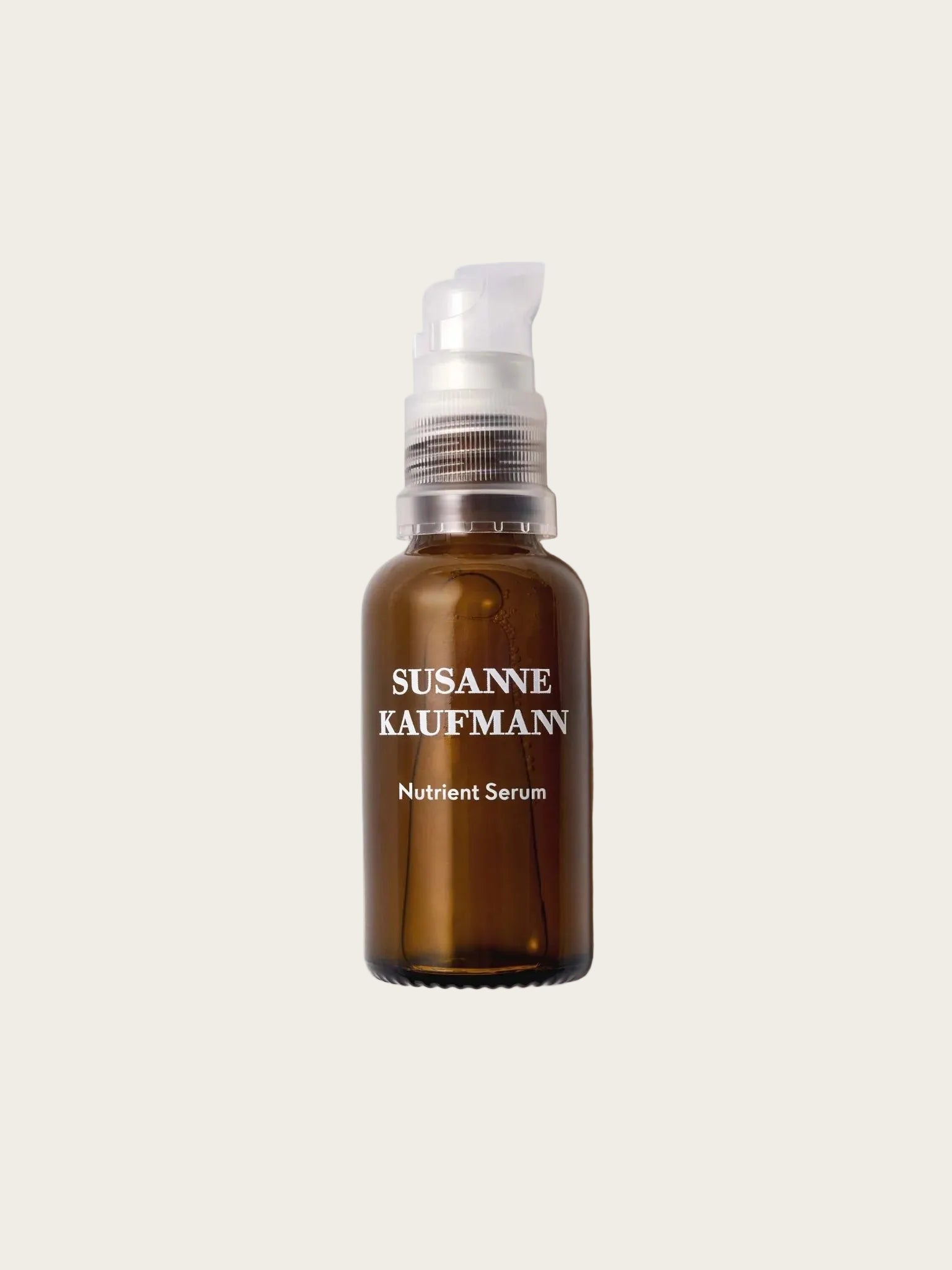 Brown bottle of Susanne Kaufmann Nutrient Serum on a white background
