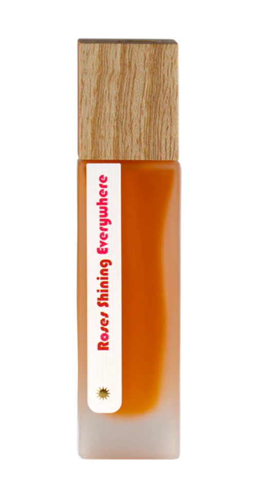Small bottle with wooden cap and white label on a white background