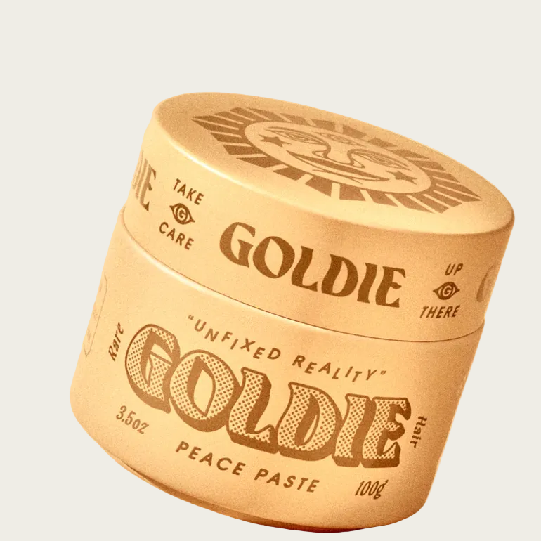 Goldie hair product jar on a beige background