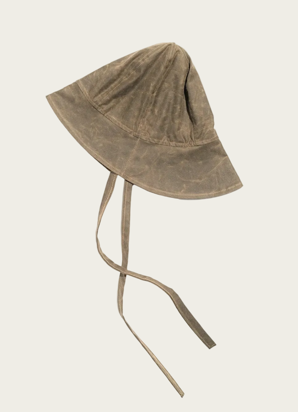 A washed brown bucket hat with a chin strap, displayed on a clean white background.