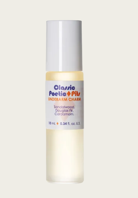 A 10 mL bottle of Classic Poetic Pitu Underarm Charm deodorant, featuring a white cap and a white label with blue and orange text, containing a pale yellow liquid, set against a plain white background.