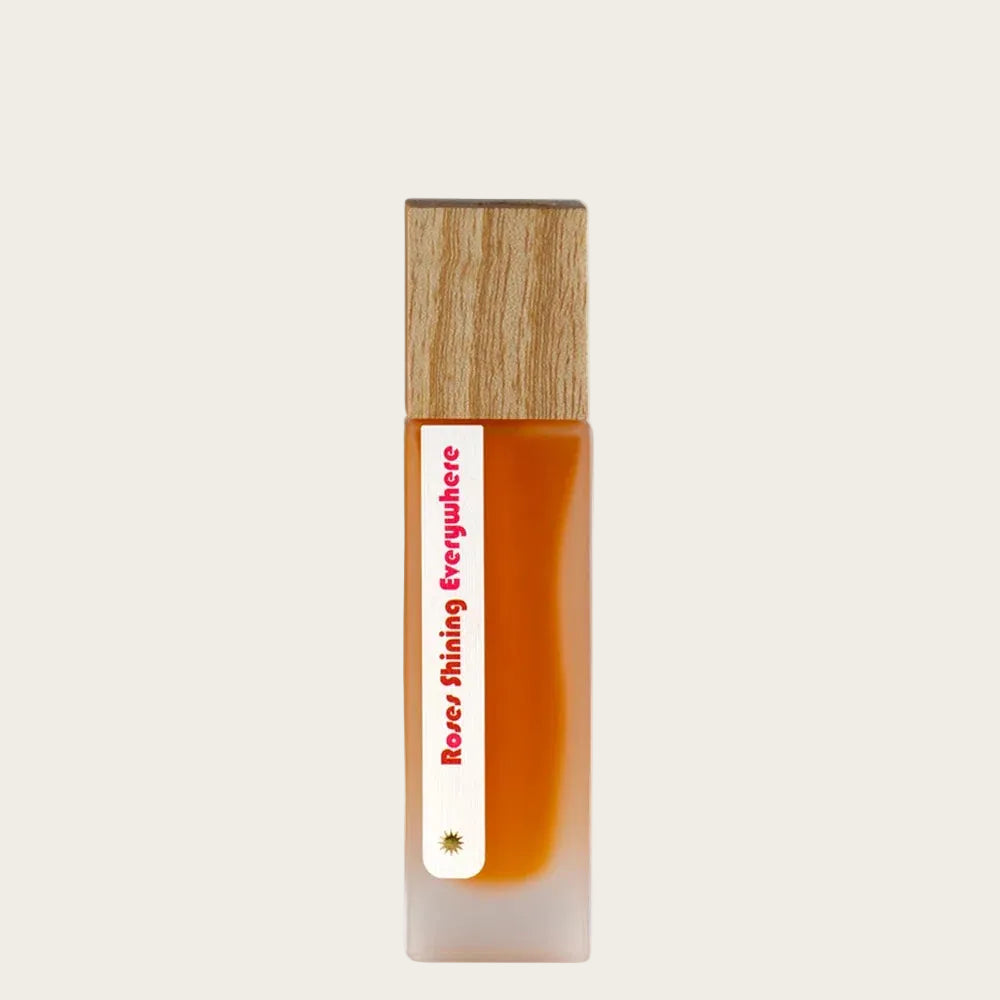 Small bottle with wooden cap and white label on a white background