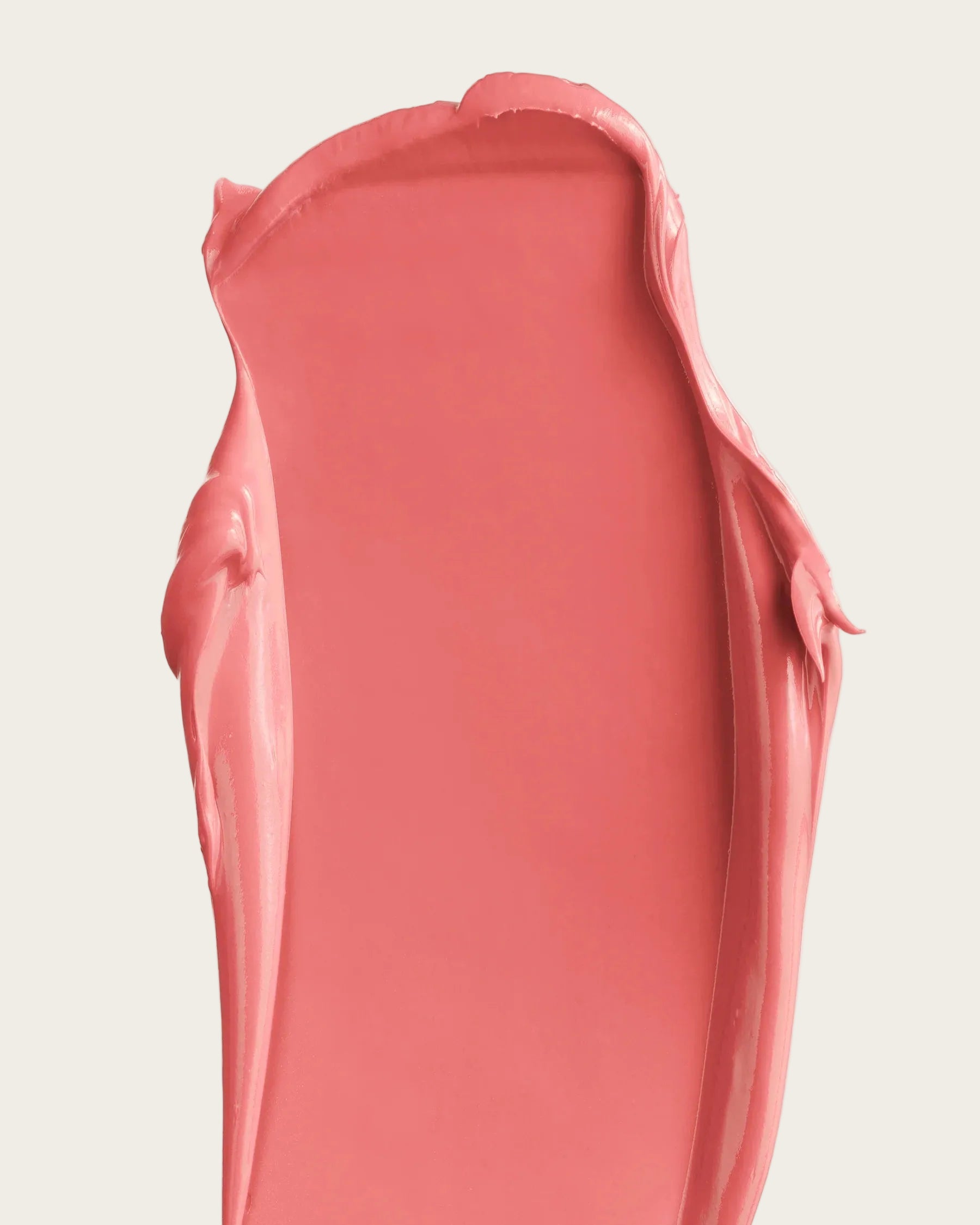 Pink lipstick swatch on a white background